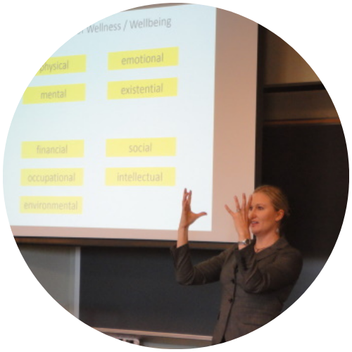 Katherine Sauer gesturing during a presentation